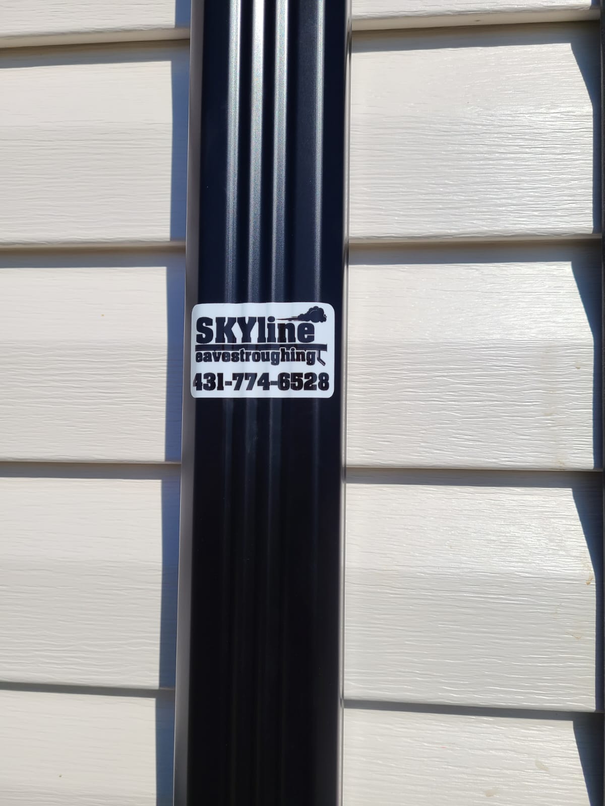 Downspout with SKYline sticker